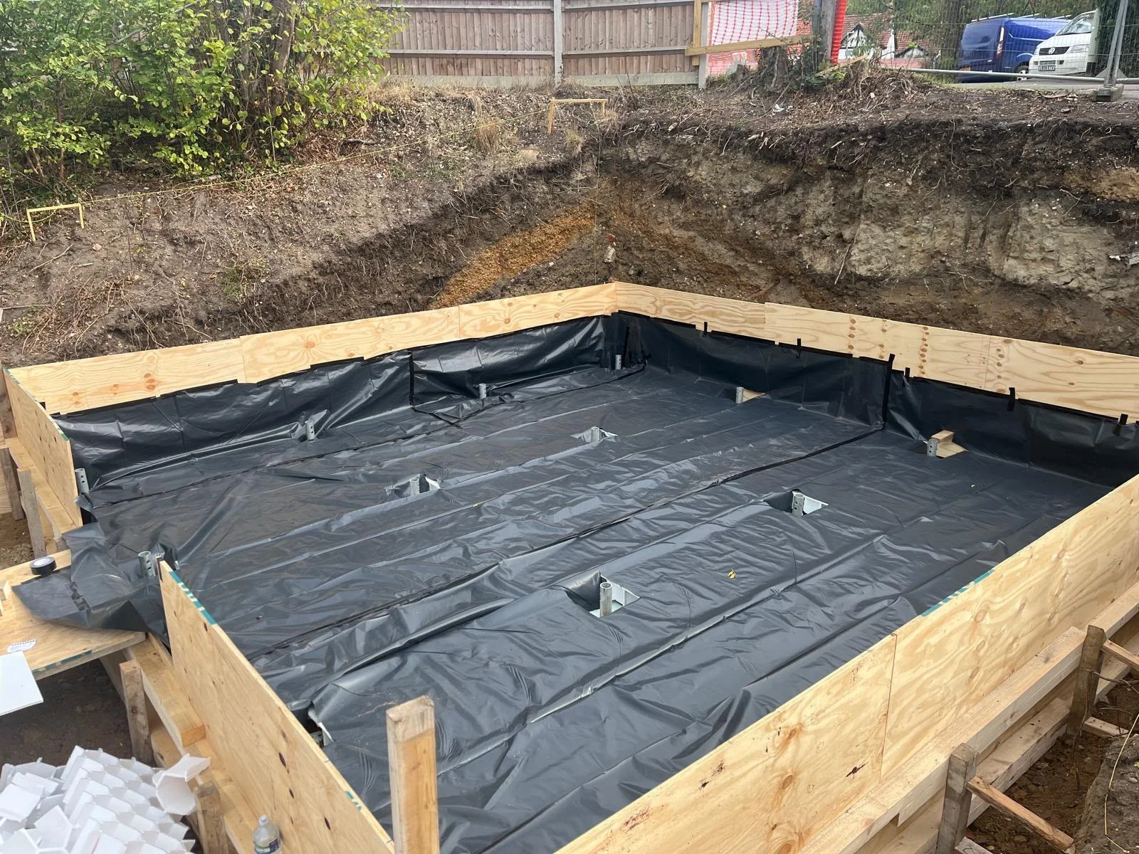 Damp-proof membrane laid across the basement foundation